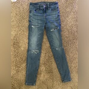 American eagle ripped blue jeans